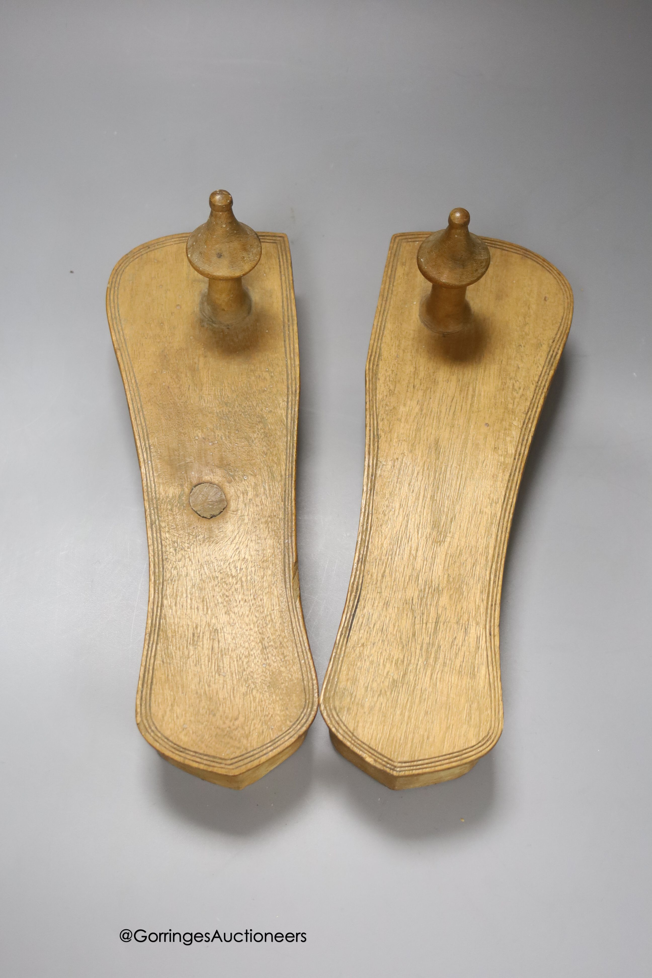 An early square wood tray, carved from the solid, possibly Spanish chestnut, 30cm, and a pair of Indian light wood stands
